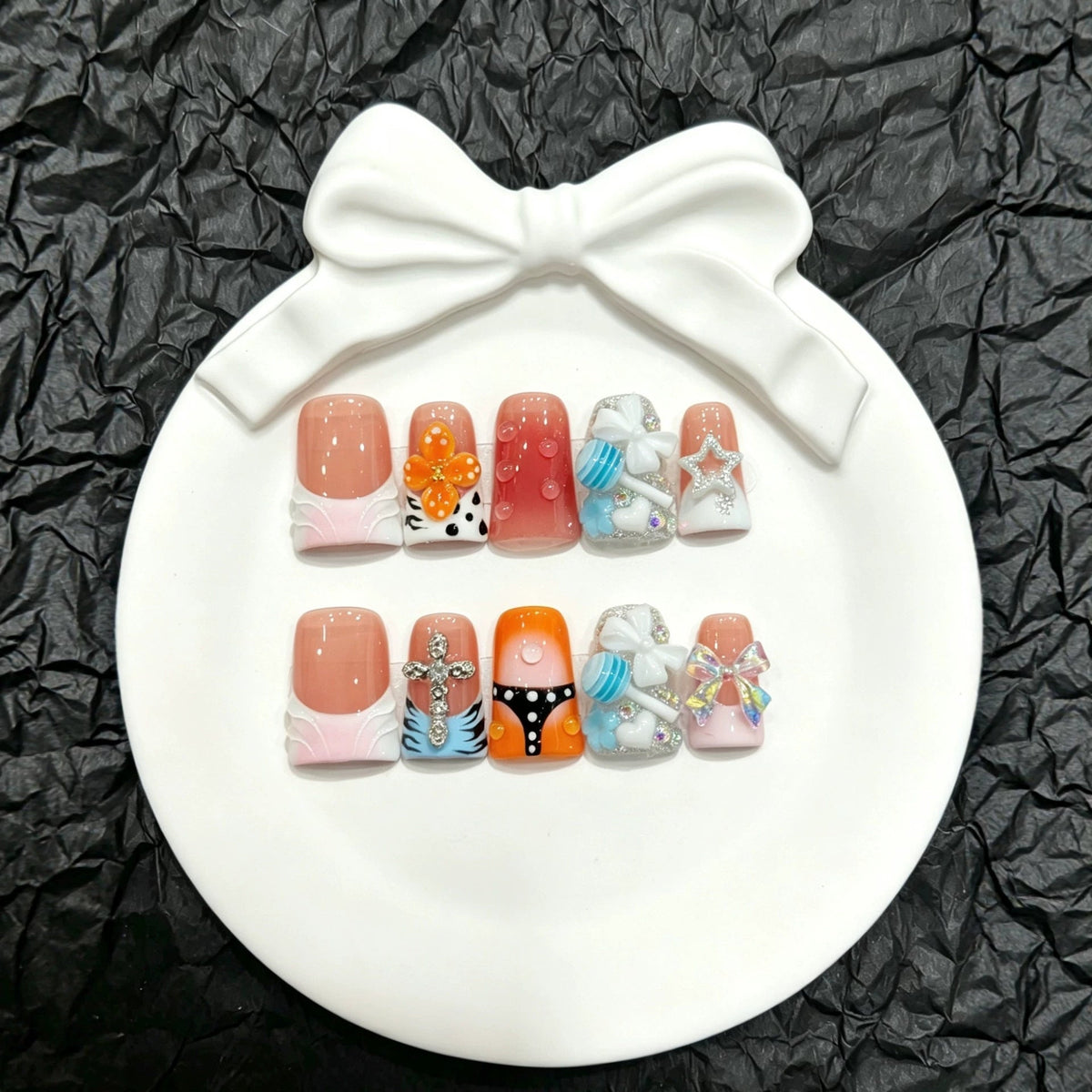 Press-On Nail Art Set with Decorative Accents and Unique Designs
