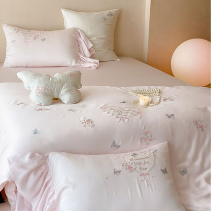 Romantic Satin Bedding Set with Embroidered Butterflies, Decorative Pillows, and Ruffles